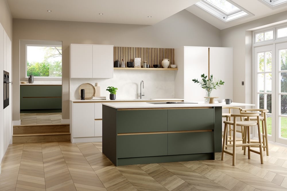 Green and white handleless kitchen