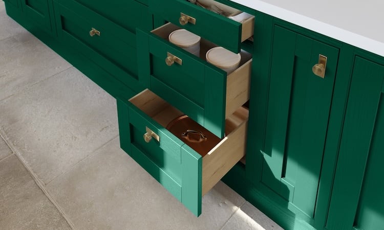 Green kitchen with oak drawers